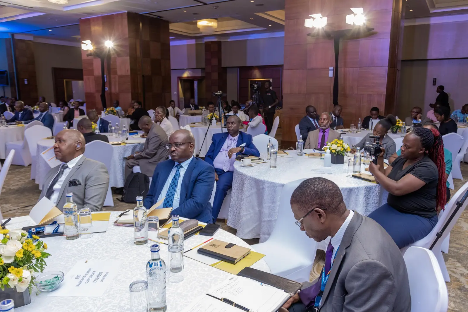 Delegates following the presentations across the hall