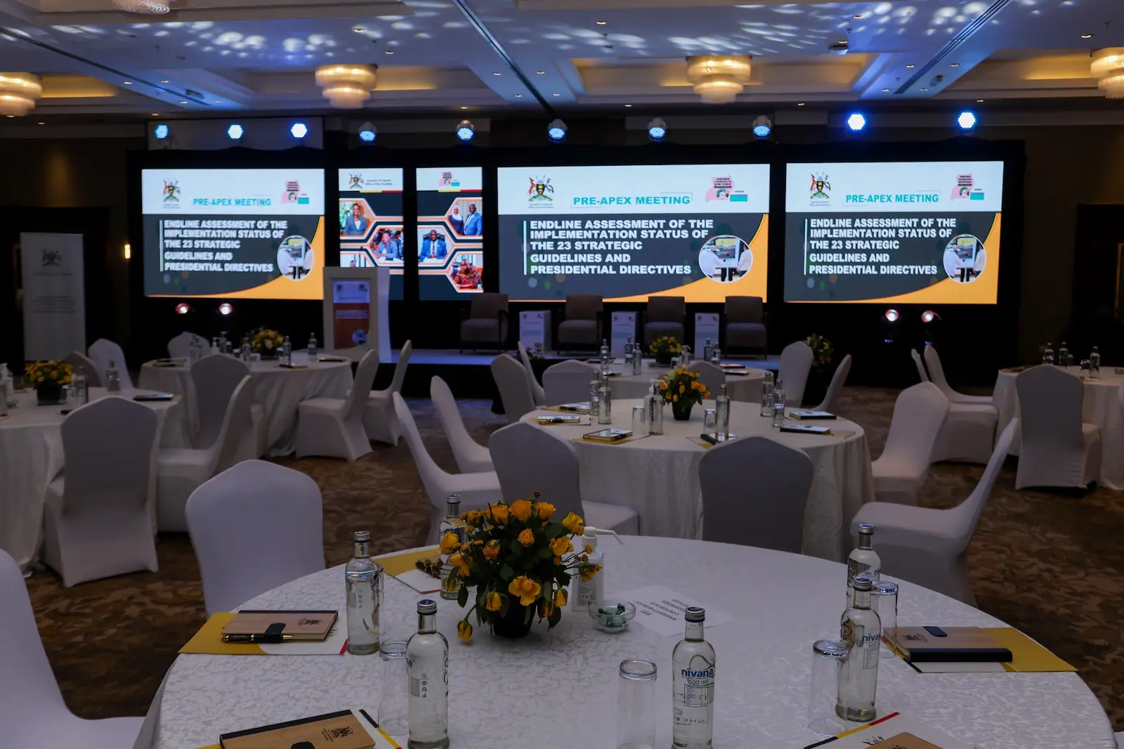 Round tables and LED screens ready before guests arrive