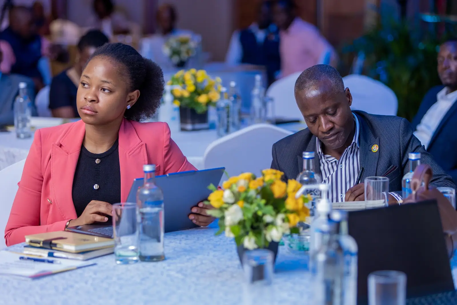 Delegate working on a laptop during the meeting