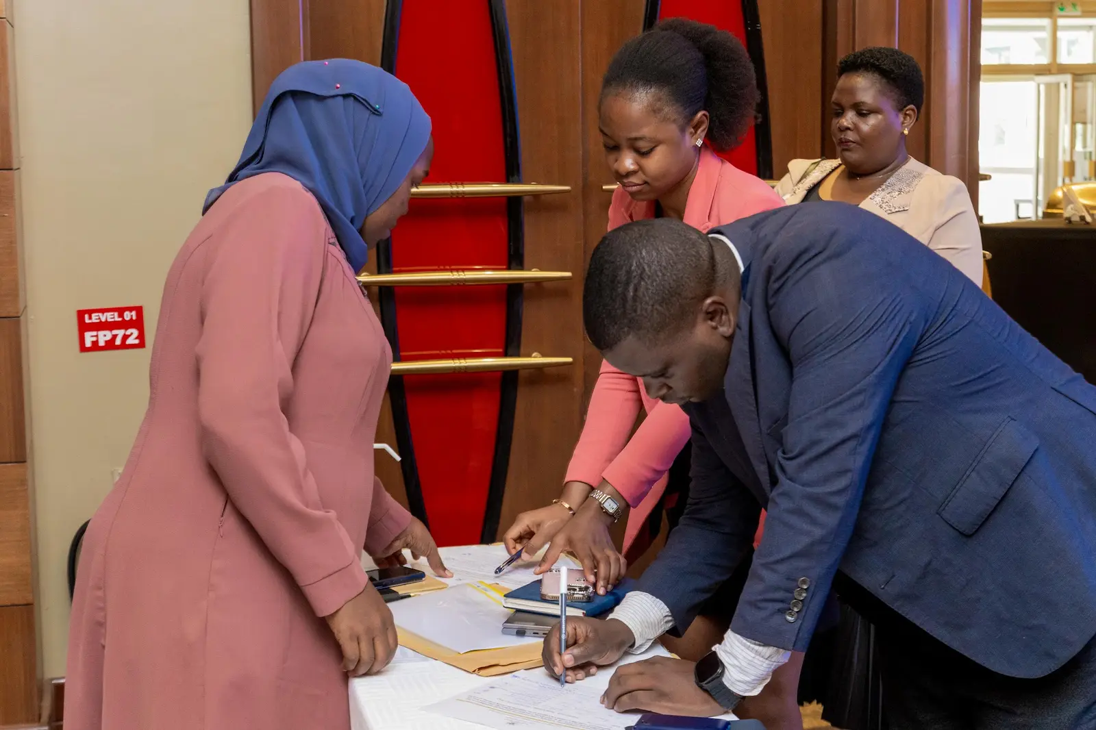 Delegates signing in at the registration desk