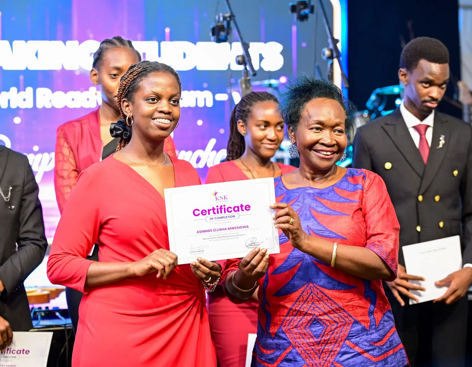 Graduates holding certificates at the KSK Foundation event