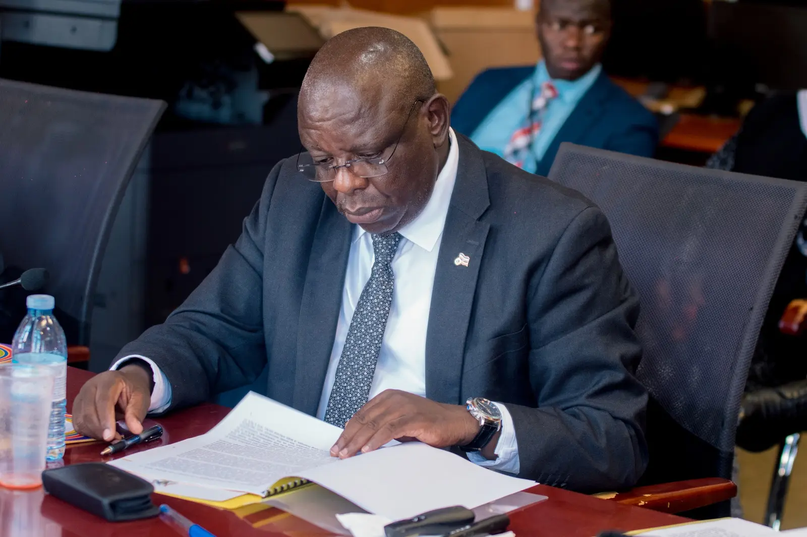 Official reviewing documents during a session