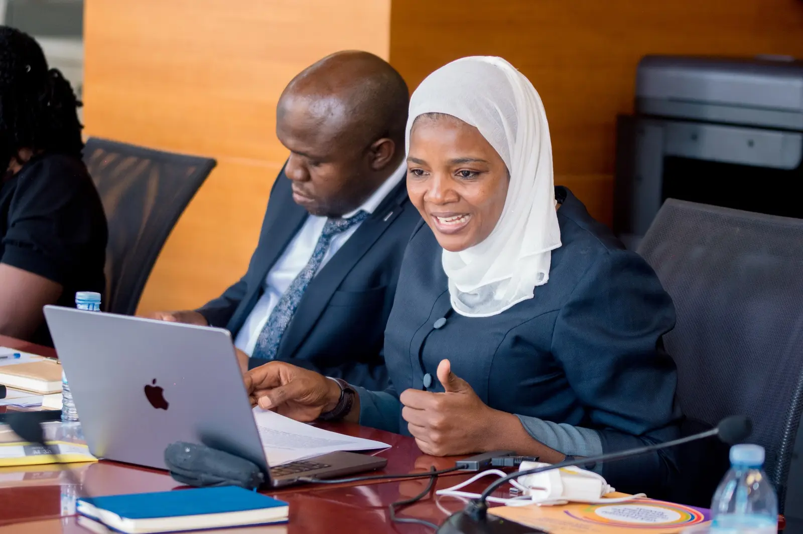 Delegates taking notes during a forum session