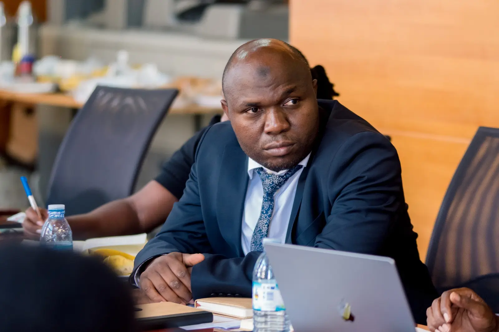 Delegate following proceedings with a laptop