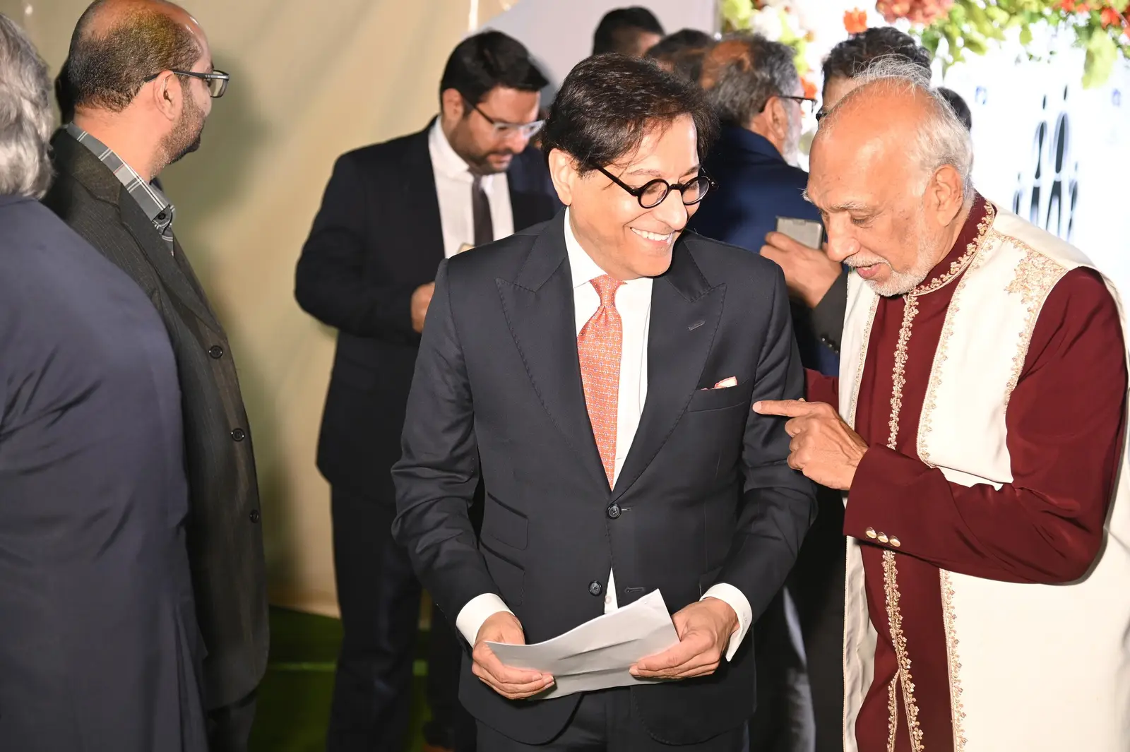 Guests greeting each other at the Punjani Charitable Trust event